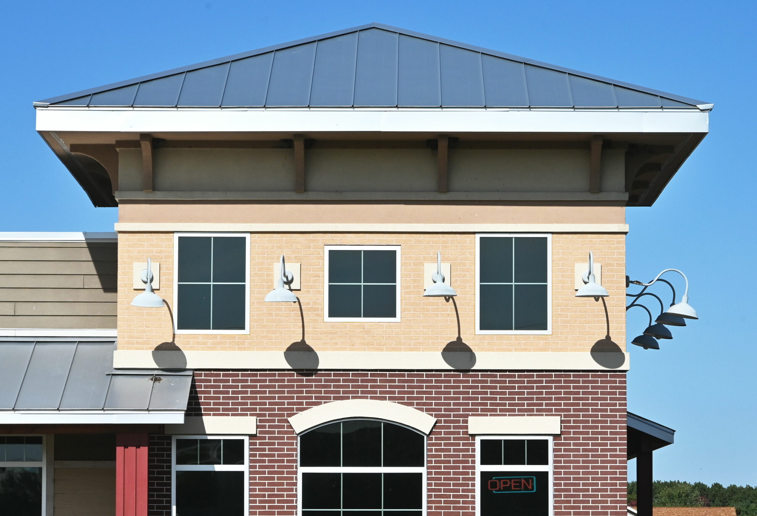 Commercial building with new metal roof installed