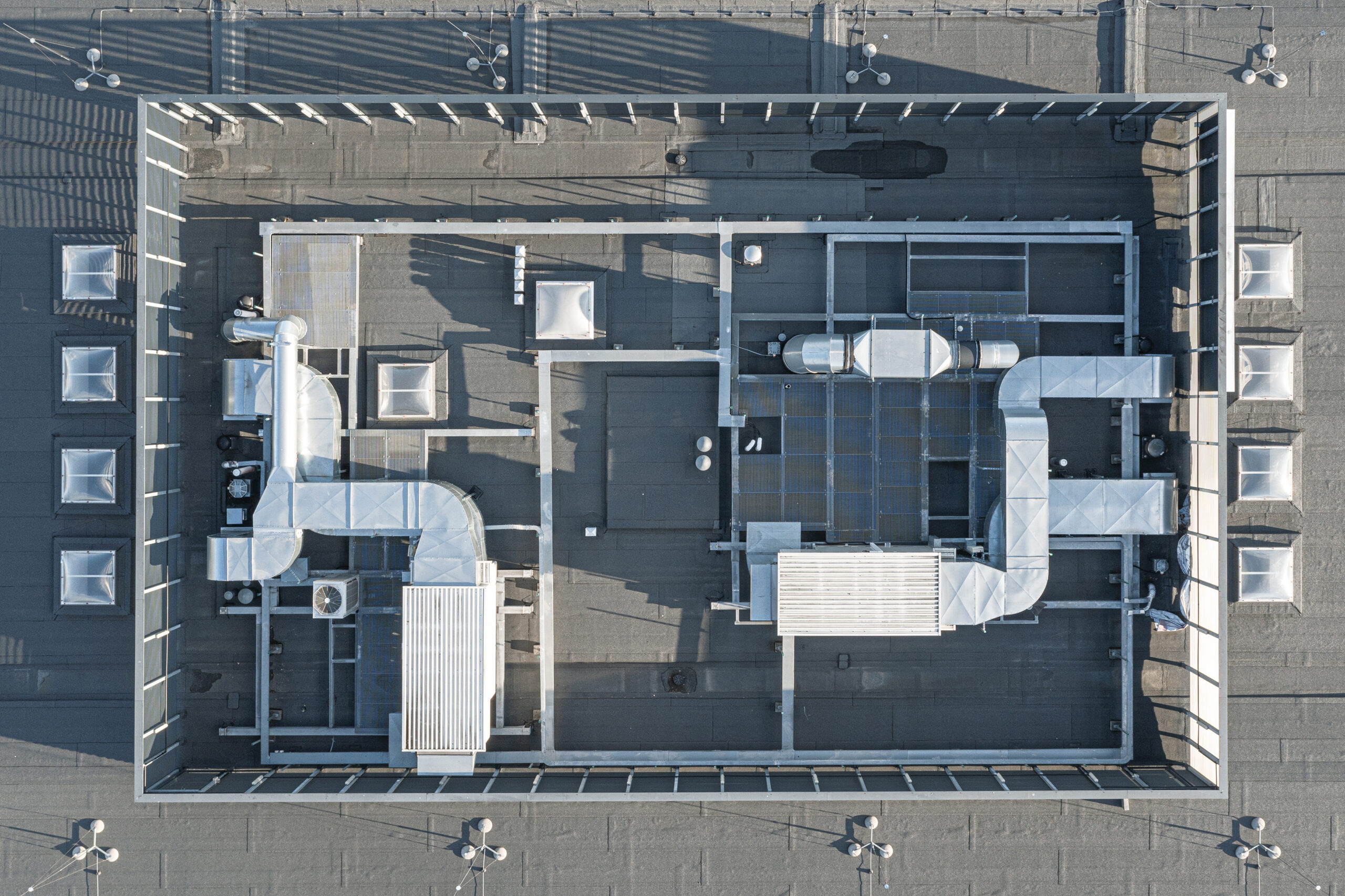 Aerial view of commercial roof with HVAC equipment on top