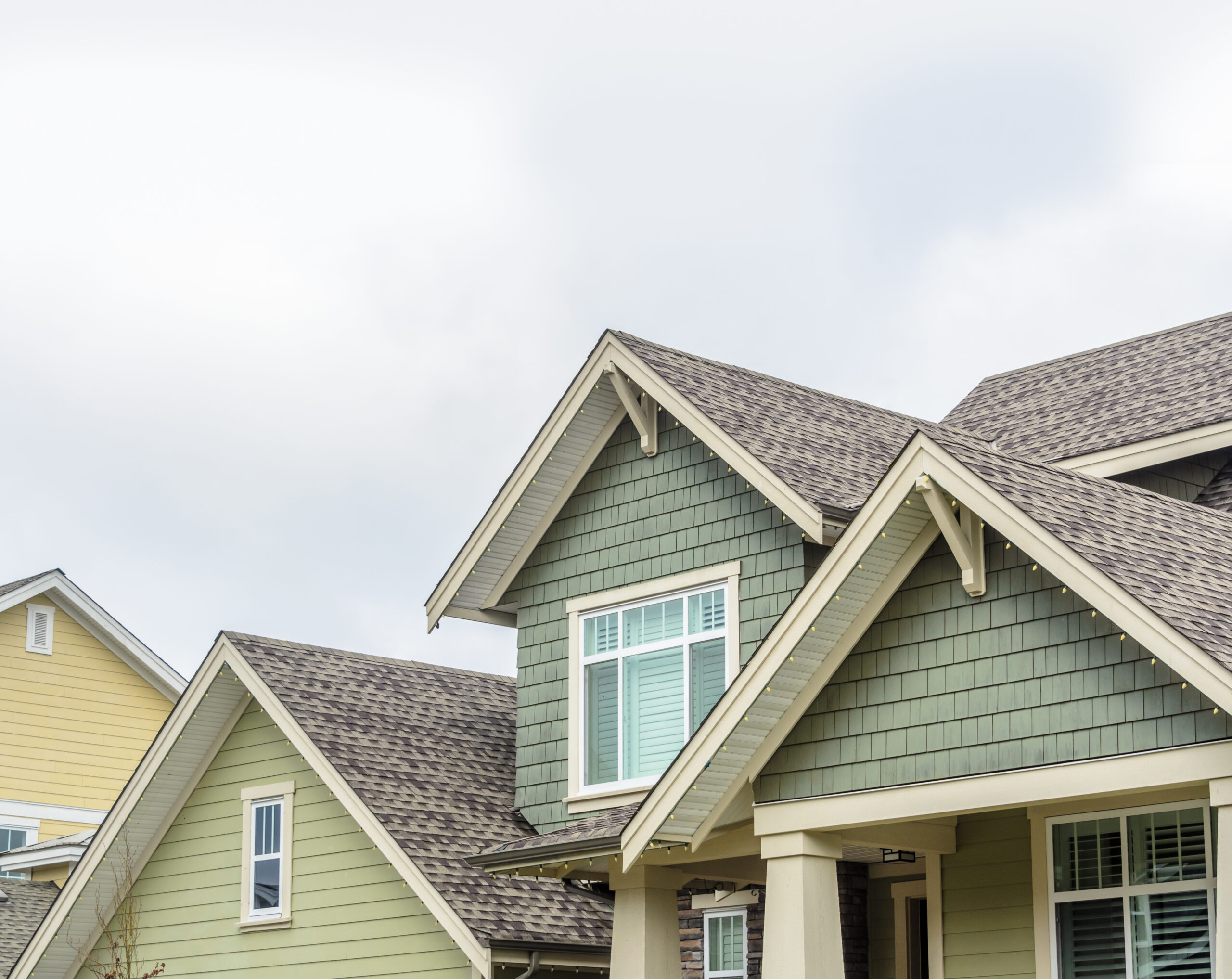 Various hues of green siding installed on home