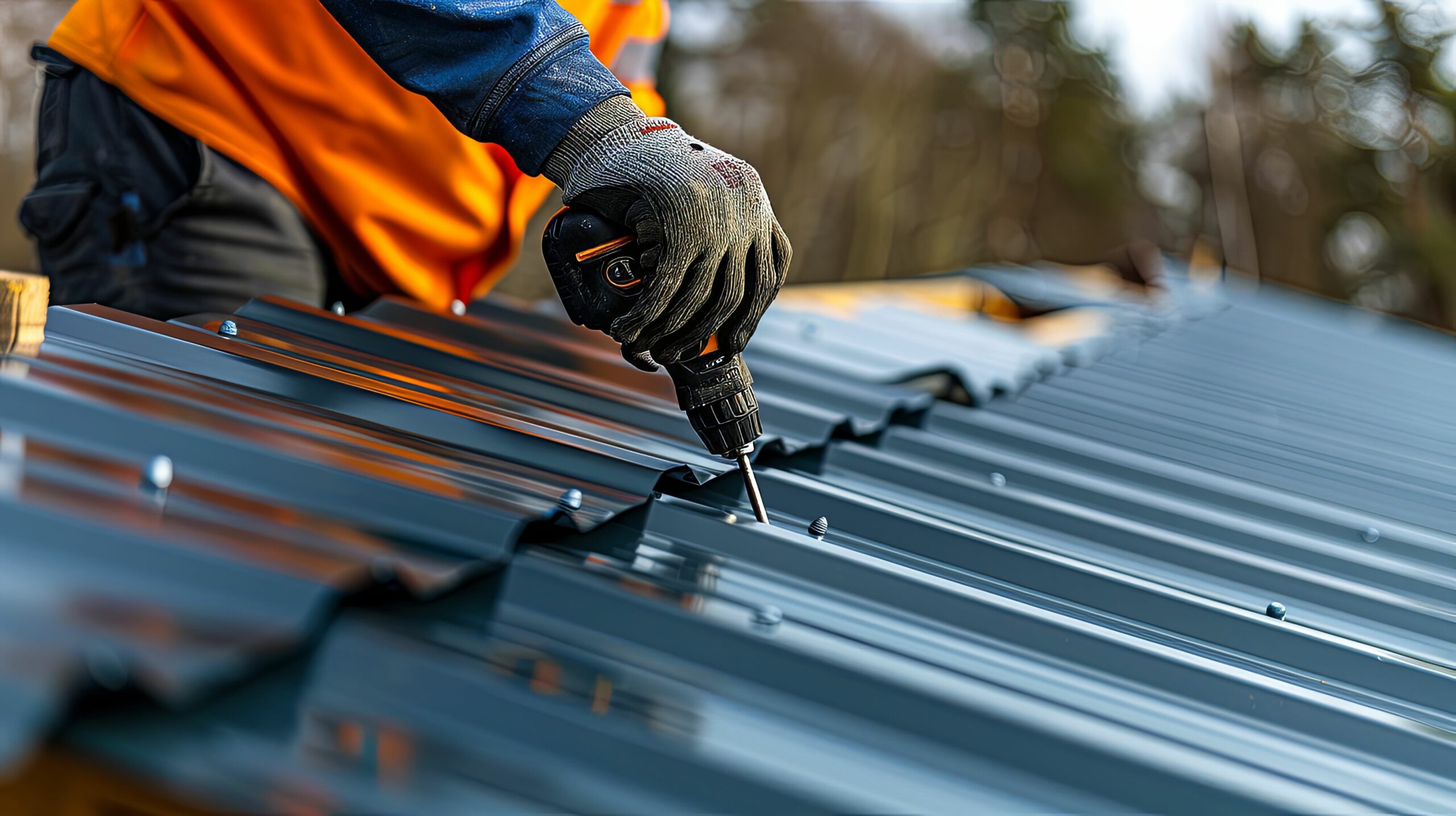 Close up image of gloved hand doing roof work